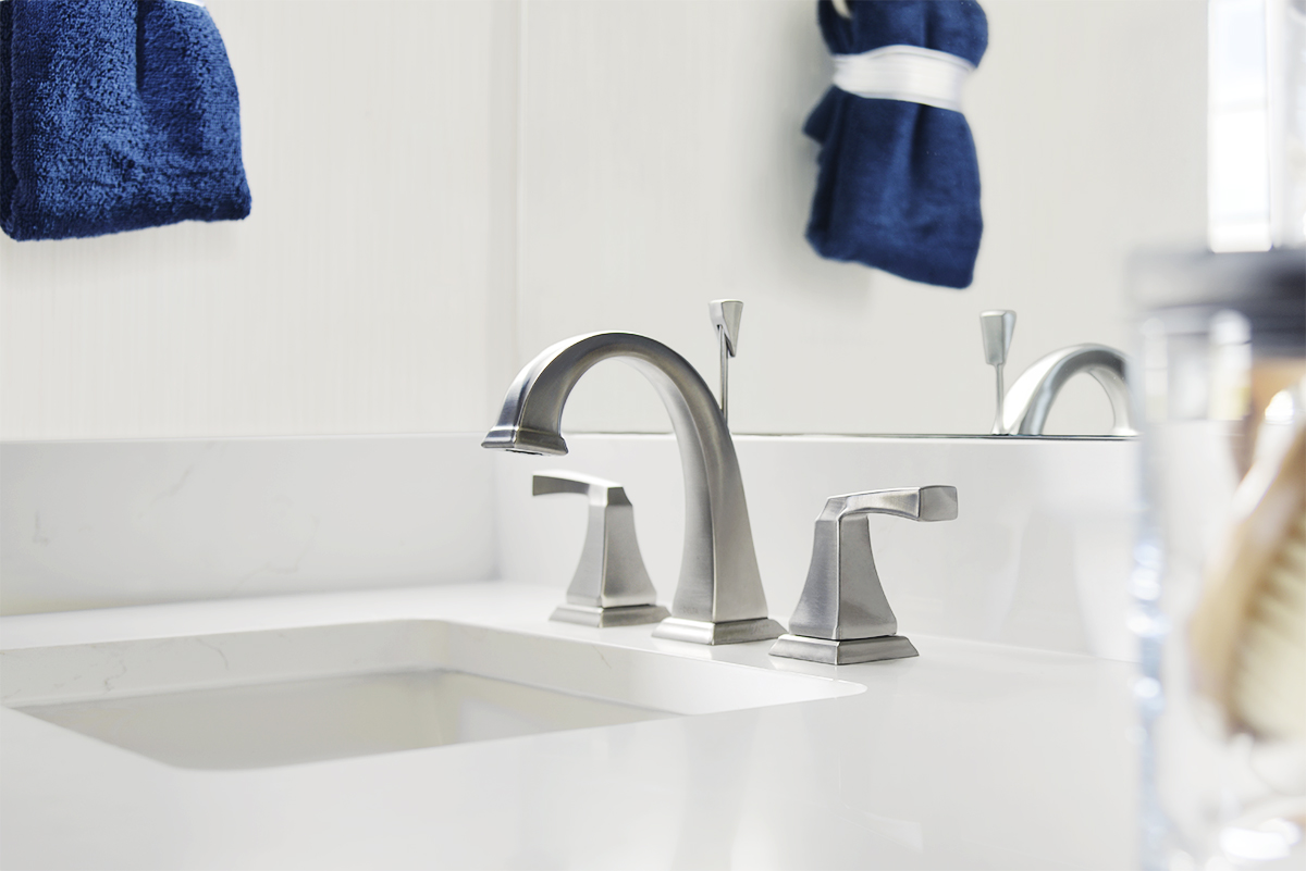 White countertop with sink and silver faucet